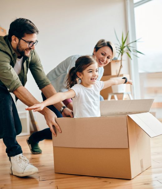 happy-daughter-having-fun-with-her-parents-while-relocating-in-new-apartment